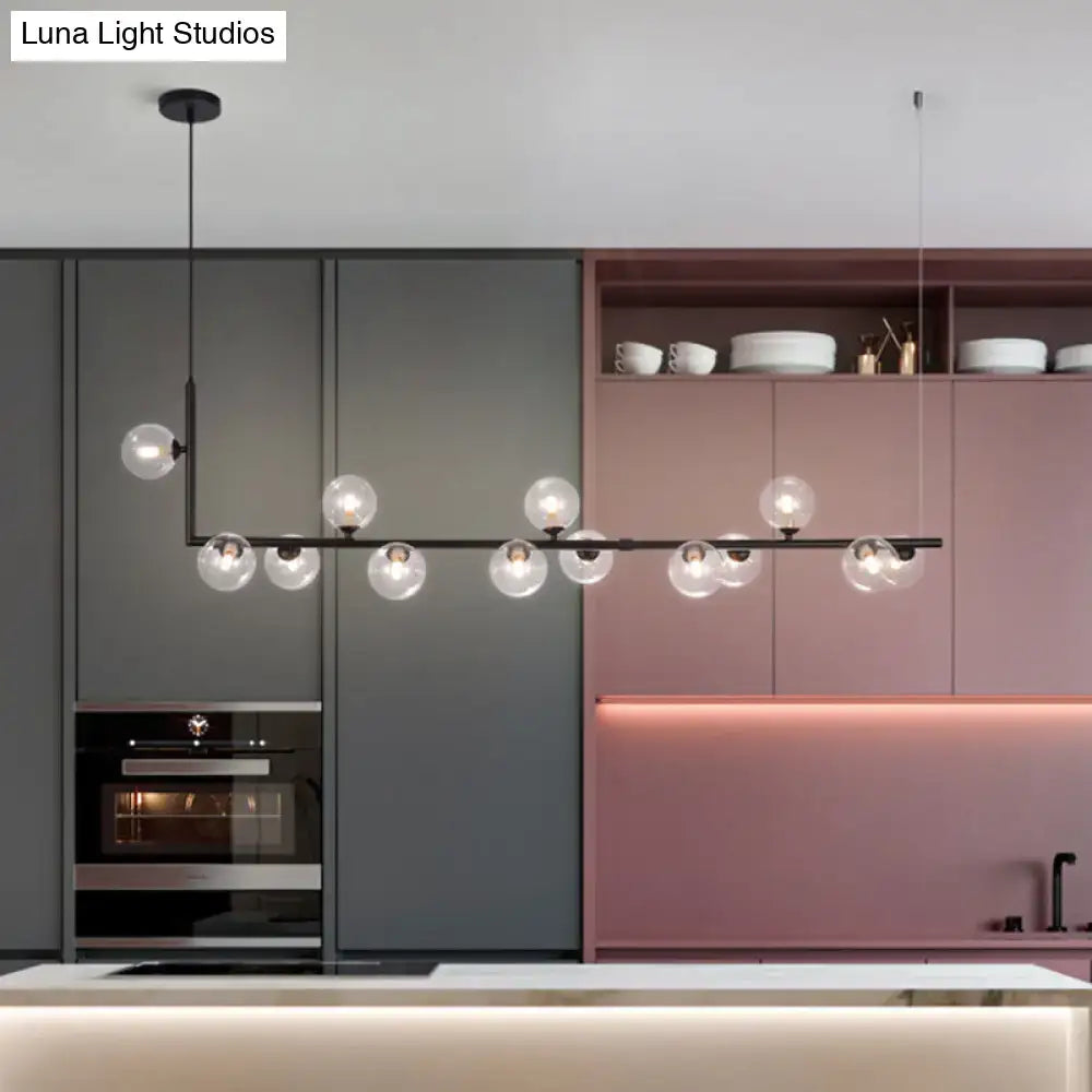 Modern black metal pendant light with clear glass globe bulbs for dining room hanging island by DecorBites™