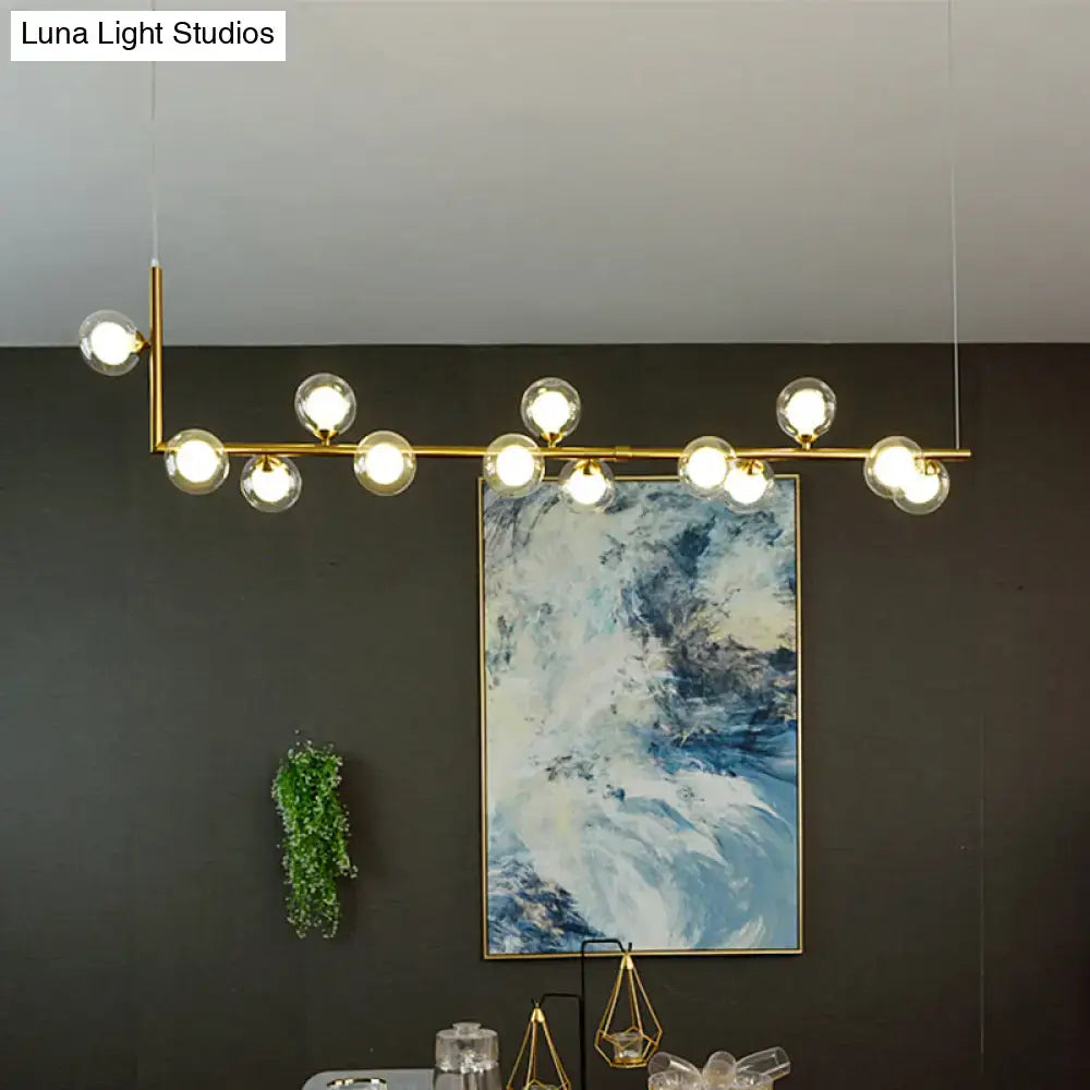 Gold-toned DecorBites™ pendant light with multiple glass bulbs for dining room hanging island lighting