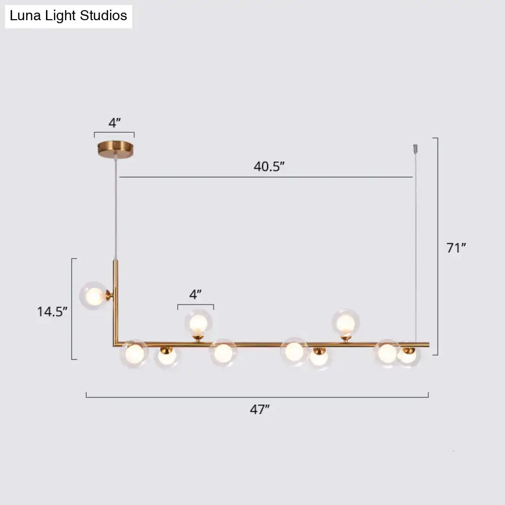DecorBites™ gold-toned pendant light with seven glass bulbs and sleek linear design for dining room hanging island