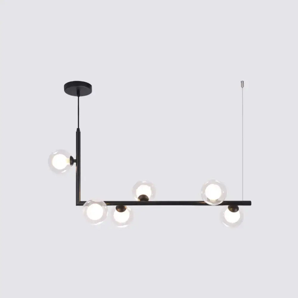 Modern black metal pendant light with five clear glass globe bulbs for dining room hanging island decor by DecorBites™