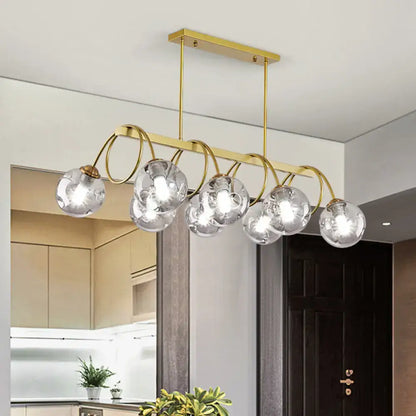 DecorBites™ sleek gold spiral island light with gold finish metal arms and clear glass globe bulbs for modern ceiling decor
