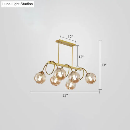 Decorbites sleek gold spiral island light with gold finish metal frame and five spherical glass globe shades