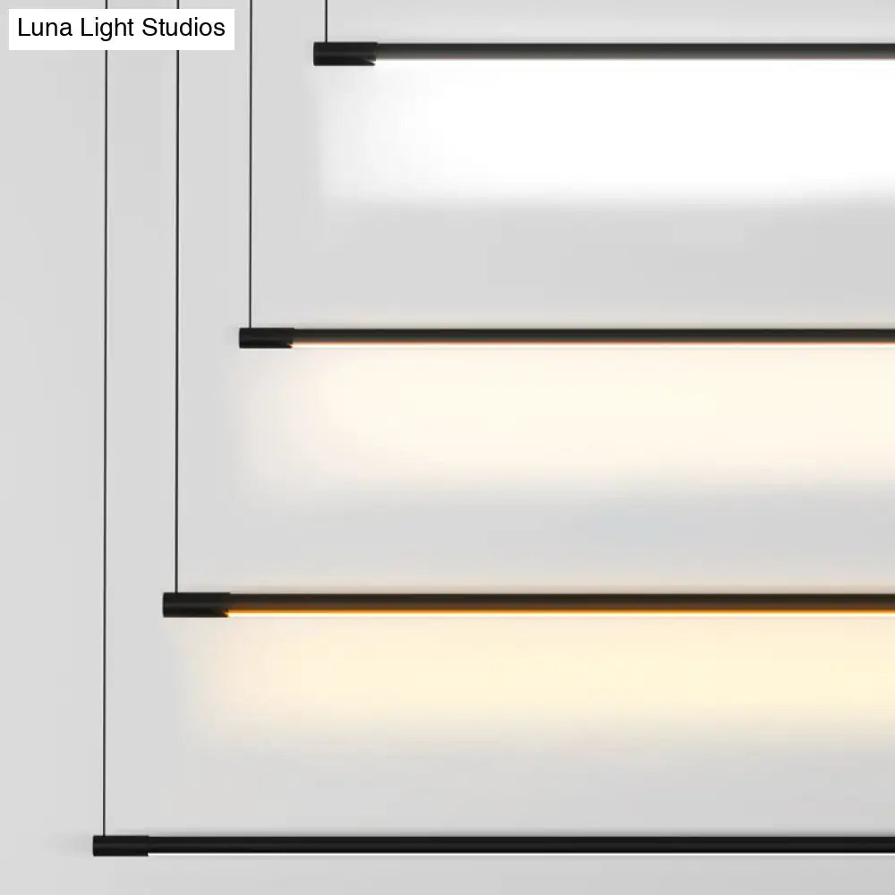 Modern black metal linear led island lamp with sleek minimalist design and warm led illumination by DecorBites