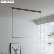 Modern black minimalist metal led island lamp with sleek linear design and thin cables for stylish island table