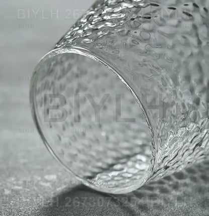 Decorbites small transparent glass vase with clear textured hammered surface for elegant home decor