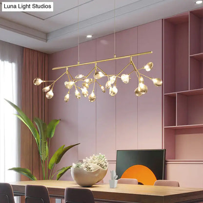 Gold-toned branch-style pendant light with clear teardrop-shaped globes for decorbites smoke grey glass firefly island lighting