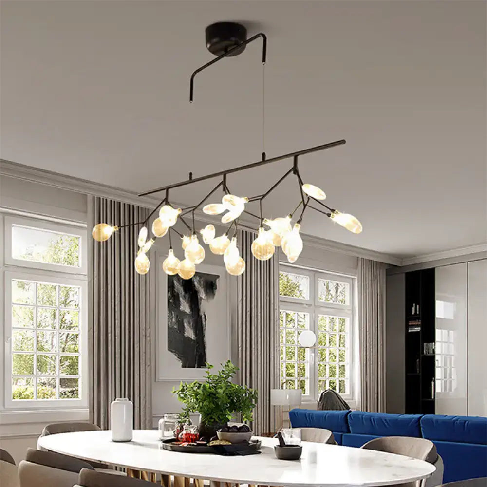 Black metal chandelier with smoke grey glass firefly frosted bulbs in a branching tree-like design for dining room lighting