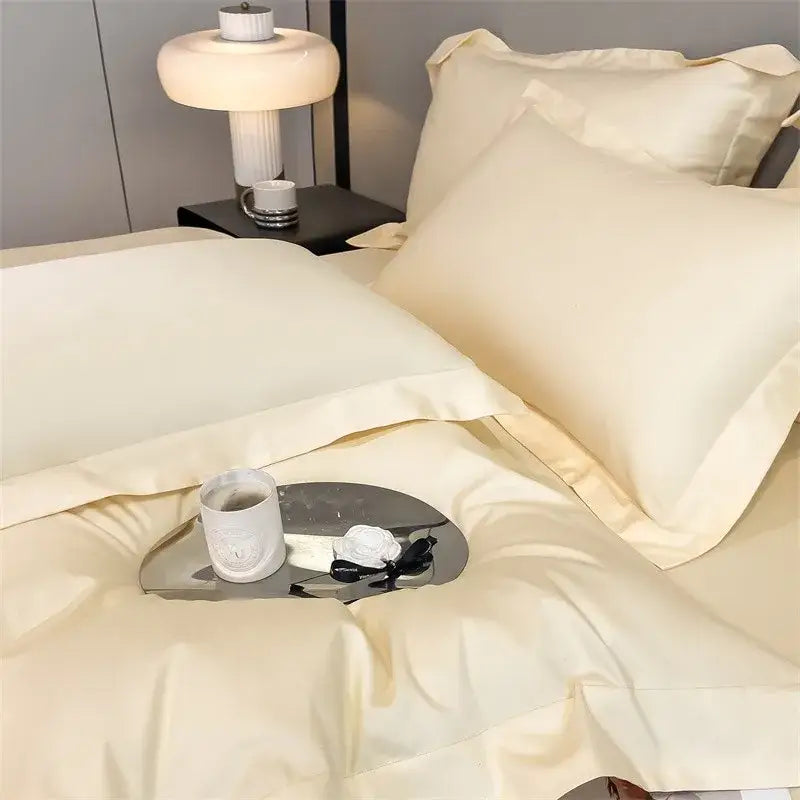 Cream-colored decorbites™ soft egyptian cotton bedding set with smooth satin duvet cover and fitted sheet with stitched edges