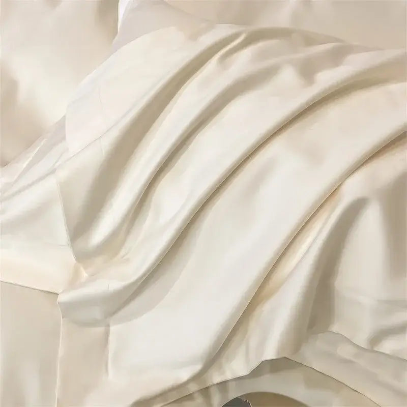 Cream-colored satin duvet cover from decorbites™ soft egyptian cotton bedding set with smooth glossy texture and soft folds