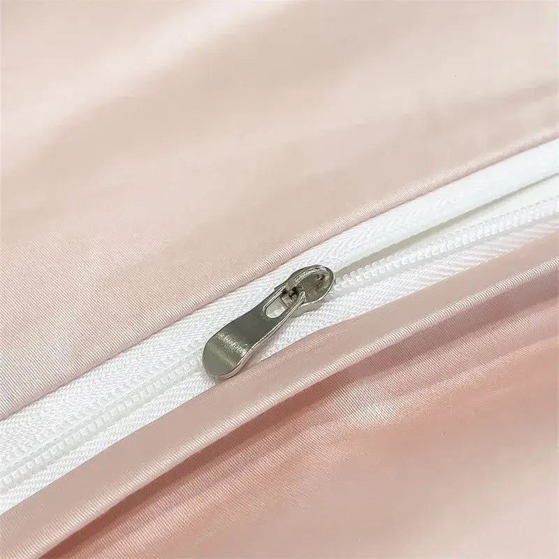 A sleek silver zipper on a soft pink satin piece duvet cover from decorbites™ soft egyptian cotton bedding set 1000tc