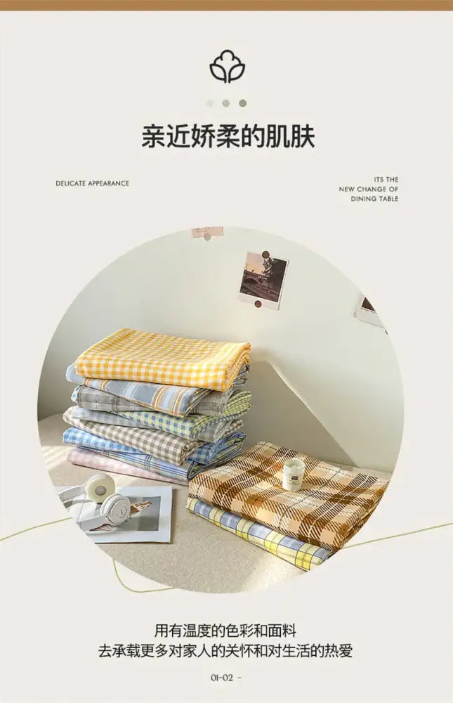 Stack of folded cotton checkered duvet cover and bed sheet in soft pastel and earthy tones from decorbites pcs duvet cover set