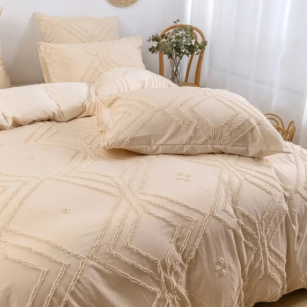 Cream-colored decorbites™ soft tufted microfiber duvet cover set with geometric embroidery and frayed edges