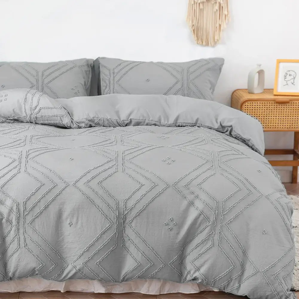 Gray quilted DecorBites™ soft tufted microfiber duvet cover set with geometric embroidery pattern for bed use