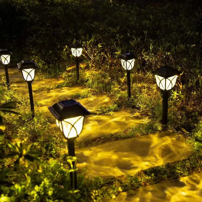 DecorBites™ solar lawn lights set features black lantern-style solar lawn lights with warm yellow illumination for outdoor garden