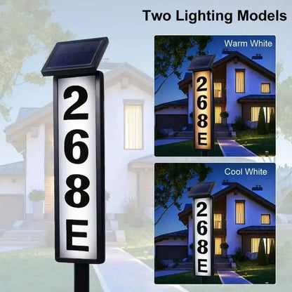Decorbites solar powered led house number sign with black frame and illuminated white face showing 268e vertically