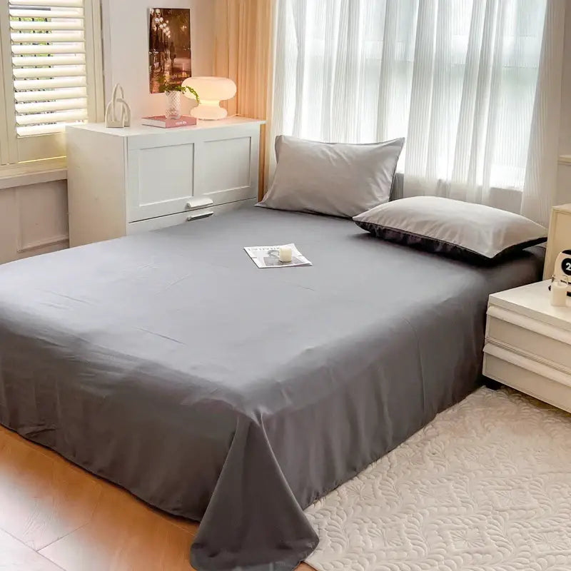 Gray solid color brush fabric duvet cover with smooth glossy finish and neatly tucked edges from decorbites bedding set
