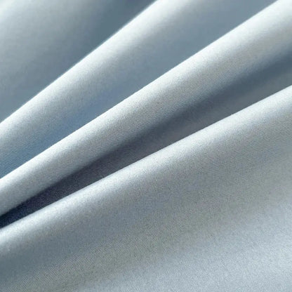 Light blue solid color brush fabric duvet cover with smooth texture and subtle diagonal weave in 4 piece bedding set