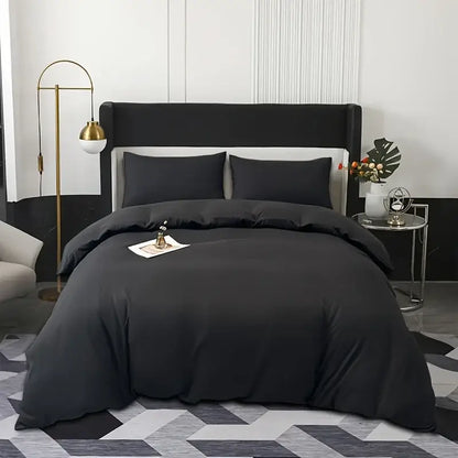 Black satin duvet cover set by decorbites with matching pillowcases featuring smooth luxurious texture and elegant drape