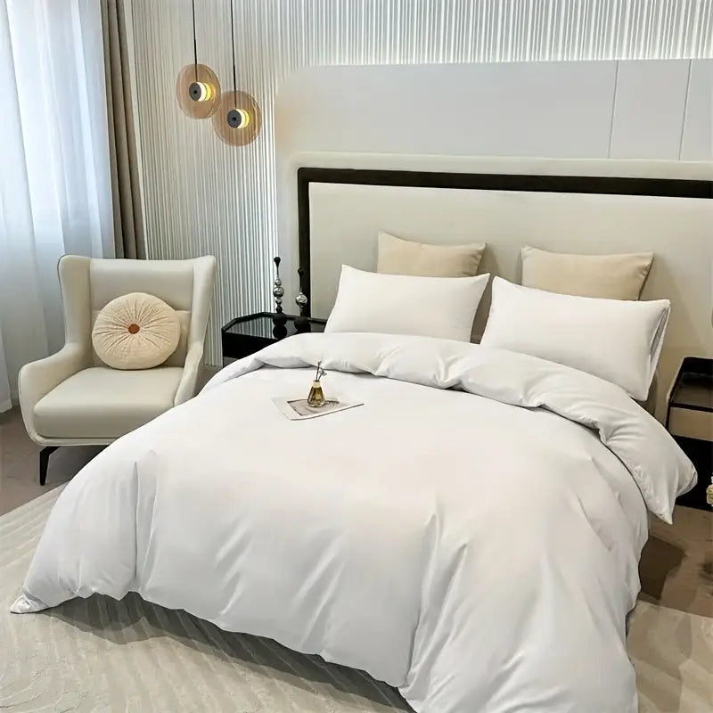 White satin decorbites™ solid color brushed duvet cover set with matching pillows elegantly arranged on modern bed