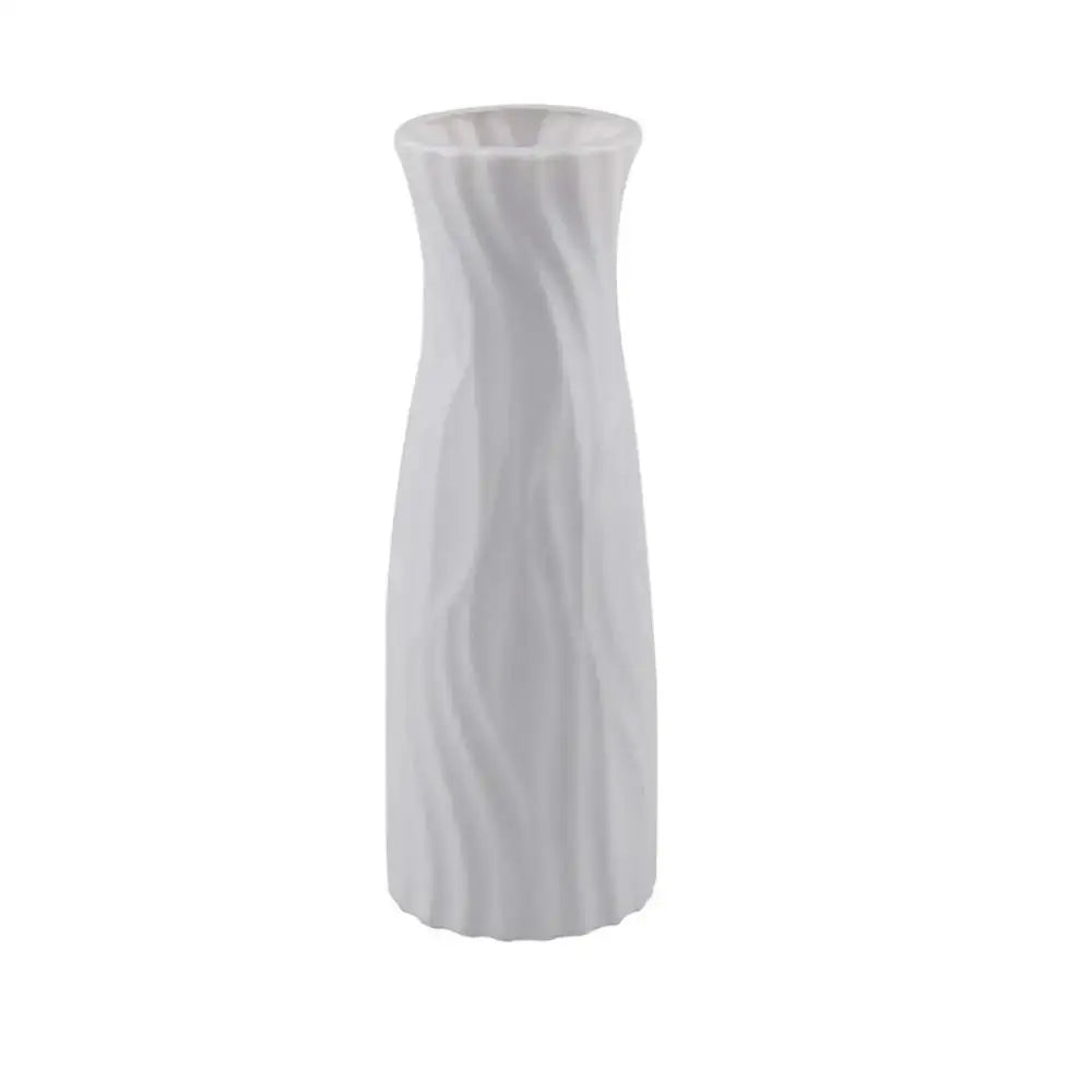 A sleek white solid color plastic flower vase with a modern twisted design for home decor by decorbites