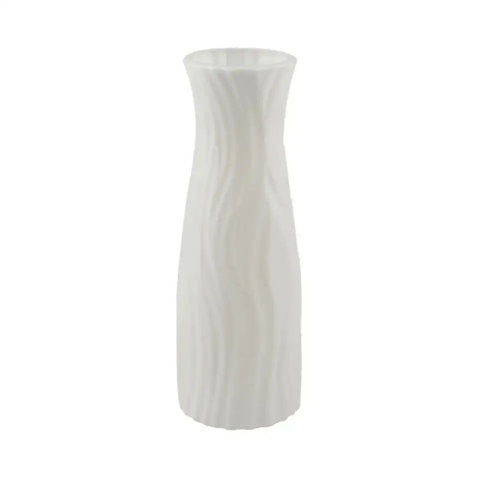 A sleek white solid color plastic flower vase with wavy texture and flared rim for home decor by decorbites
