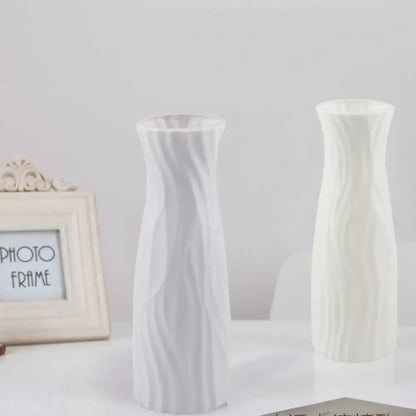 Two elegant solid color white plastic flower vases with swirling ribbed texture for home decor by DecorBites