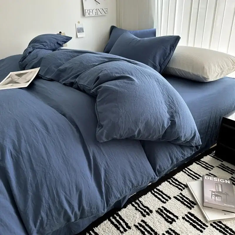Blue linen duvet cover and matching pillows in a textured solid cotton bedding set by decorbites for various sizes