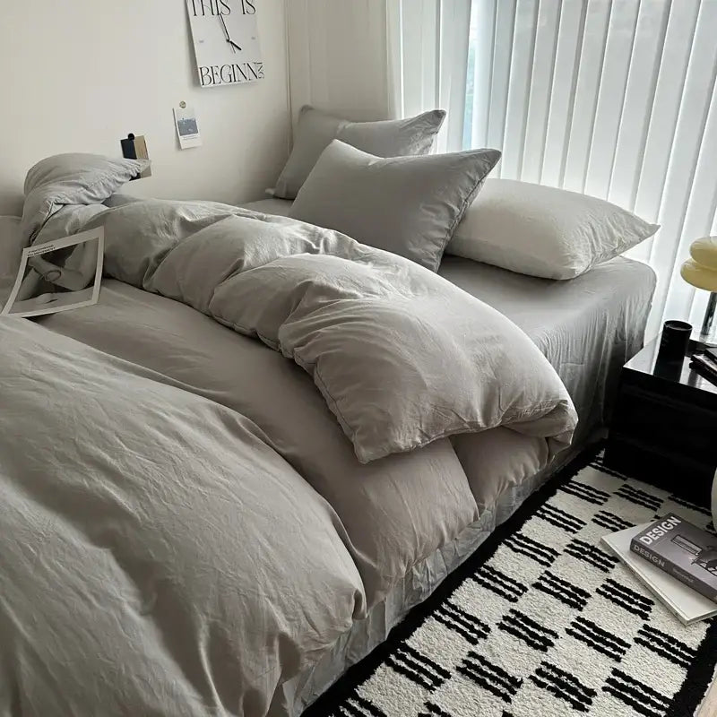 Decorbites solid cotton bedding set with soft gray duvet cover and matching pillows in various sizes