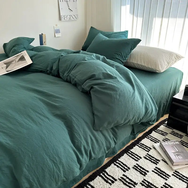 Teal-colored soft textured solid cotton bedding set with matching pillows and rumpled duvet cover by decorbites