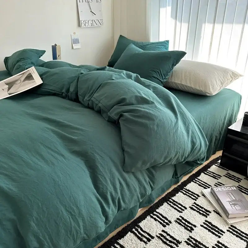 Teal-colored soft textured solid cotton bedding set with matching pillows and rumpled duvet cover by decorbites