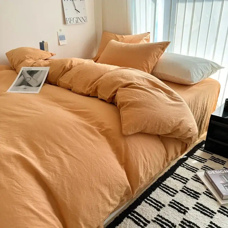 Decorbites™ solid cotton bedding set in warm orange with duvet cover and matching pillows featuring soft texture