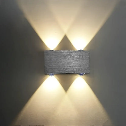Gray rectangular DecorBites™ Sphera modern LED cube box wall sconces with textured stone-like finish and warm symmetrical lights