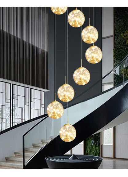 Golden spherical crystal ball chandelier light with intricate glowing patterns in a modern decorbites spiral design
