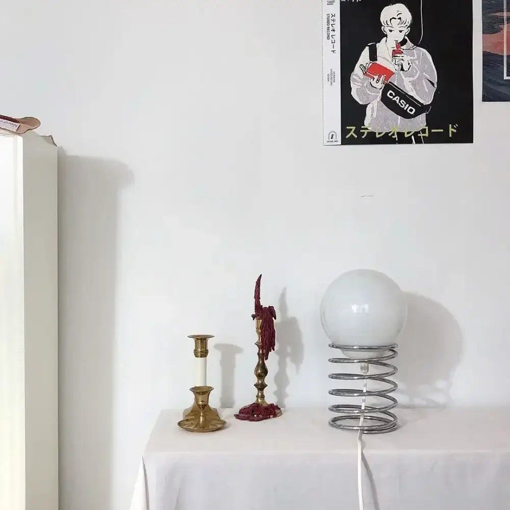 DecorBites™ spring glass table lamp with white spherical glass shade and metallic spring base for modern decor