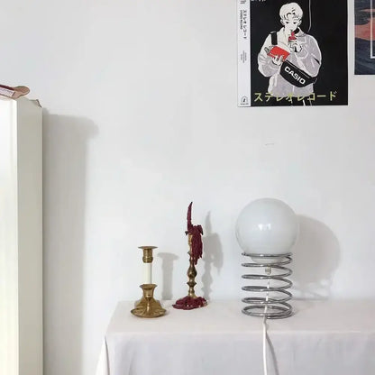 DecorBites™ spring glass table lamp with white spherical glass shade and metallic spring base for modern decor