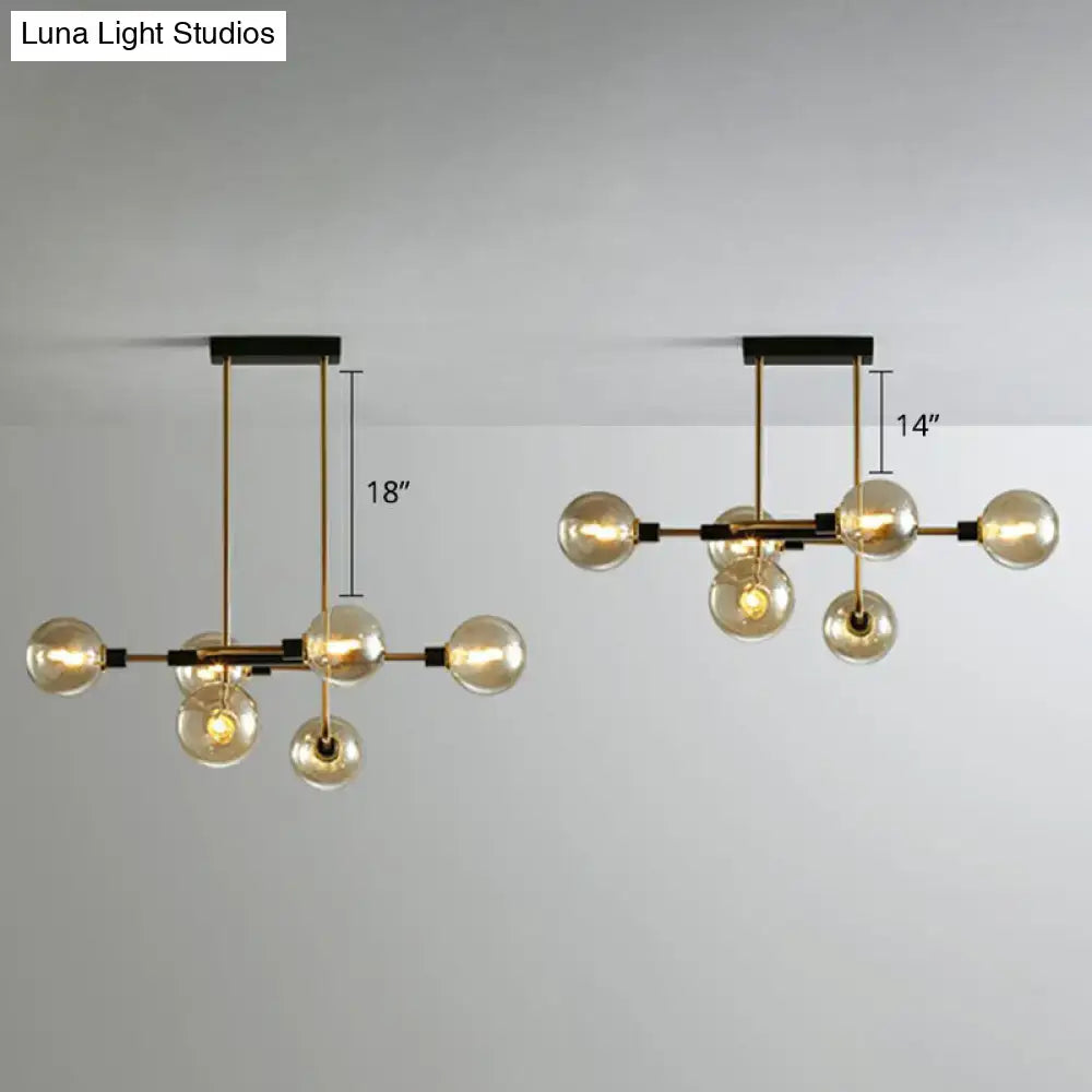 Modern brass décorBites™ sputnik hanging island light with spherical glass bulbs and black mounting for dining room