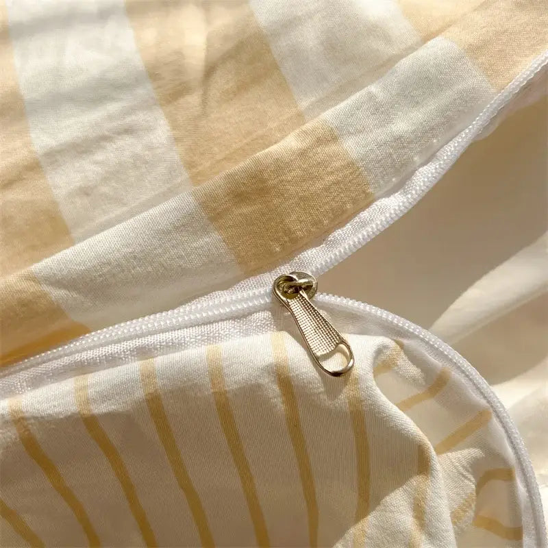 DecorBites™ striped quilt set featuring a cream and beige striped cotton duvet cover with a gold-toned zipper bed sheet