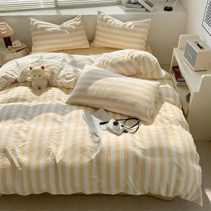 Cream and white vertically striped quilt set with pillowcases and soft textured fabric bed sheet by DecorBites™