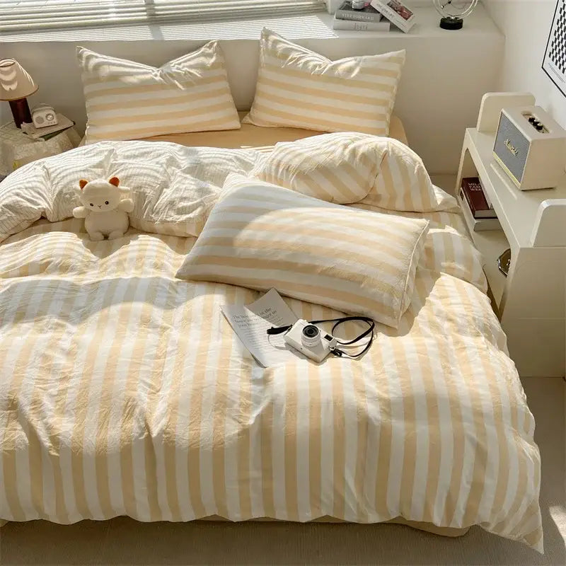 Cream and white vertically striped quilt set with pillowcases and soft textured fabric bed sheet by DecorBites™