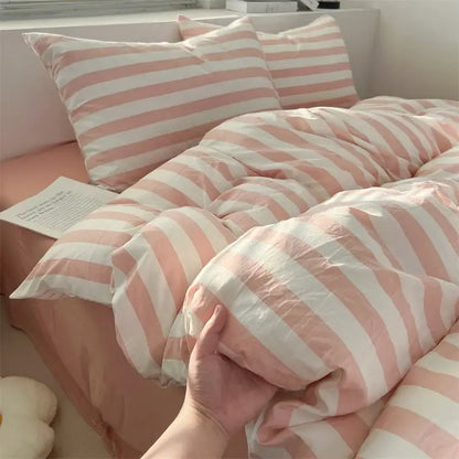 DecorBites™ striped quilt set with pink and white bed sheet featuring soft, slightly wrinkled fabric texture