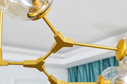 Decorbites™ stylish gold-toned metal chandelier with clear glass globe shades modern chandelier lighting for dining rooms
