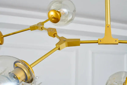 Gold-toned metal decorbites™ stylish chandelier with clear glass globe bulbs modern chandelier lighting for dining rooms