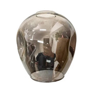 A sleek translucent amber glass vase complements the decorbites™ stylish nordic chandelier for living room and dining