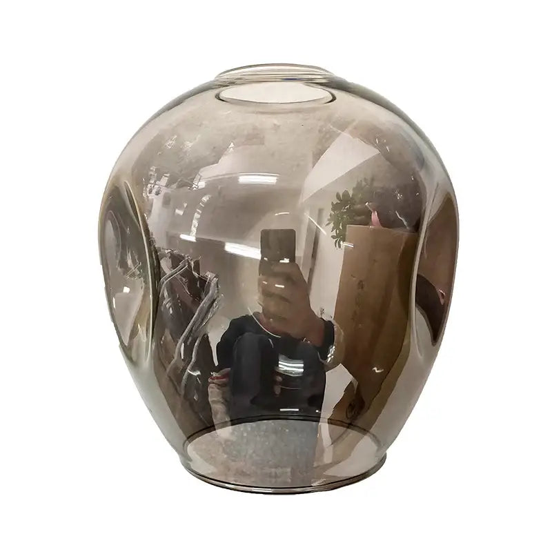 A sleek translucent amber glass vase complements the decorbites™ stylish nordic chandelier for living room and dining