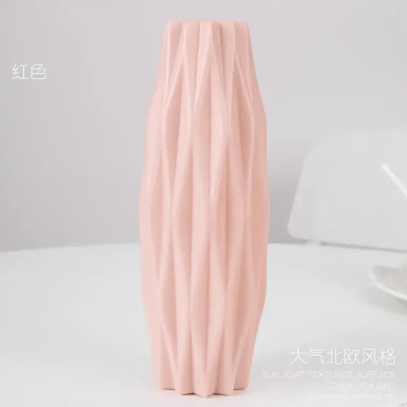 A blush pink DecorBites™ stylish nordic plastic flower vase with a textured ribbed surface and modern design
