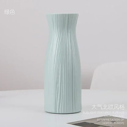 DecorBites™ stylish nordic light green ceramic flower vase with vertical ribbed texture and slender neck for home decor
