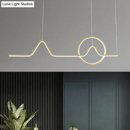 Modern gold-toned led pendant island light with sleek abstract wave and circular design for warm white third gear ambiance