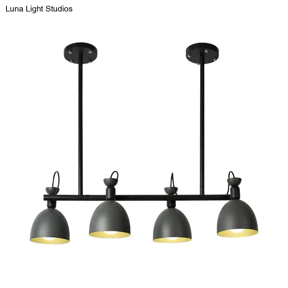 Black industrial-style pendant light fixture with four dome shades emitting warm glow 110v-120v light type for dining room