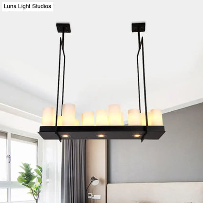Black metal island pendant light with barrel frosted glass and warm candle-style bulbs for dining room lighting