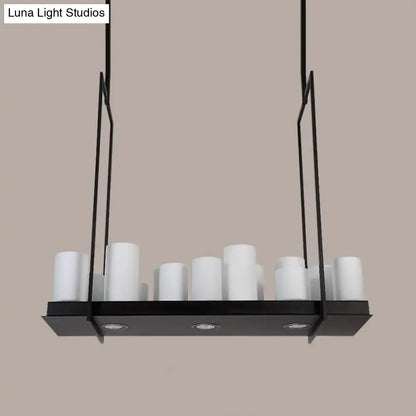 Modern black metal island pendant light with traditional barrel frosted glass cylindrical shades and recessed lighting